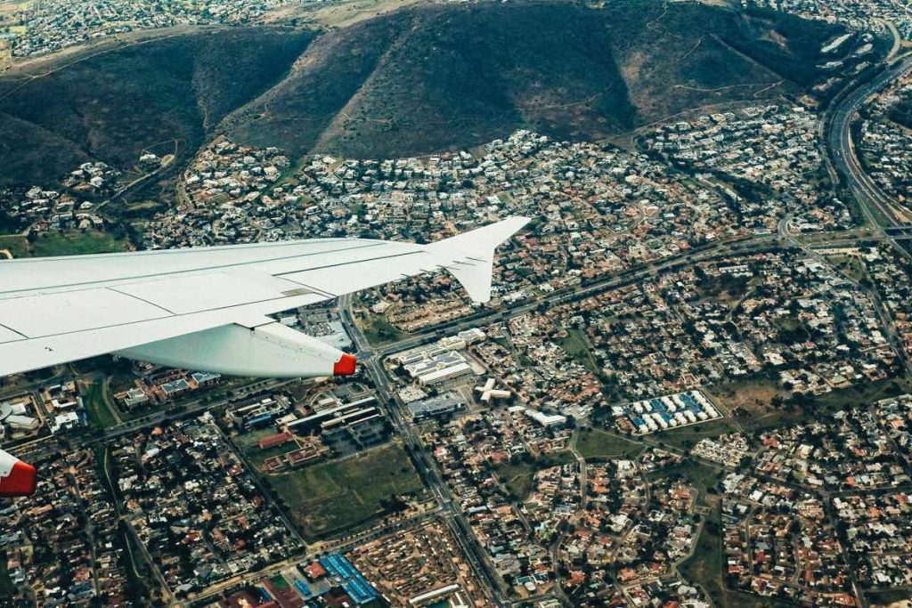 An aeroplan flies over Cape Town.