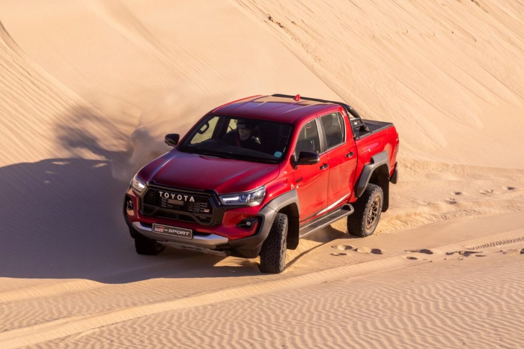 The new Toyota Hilux GR-Sport on a sand dune.
